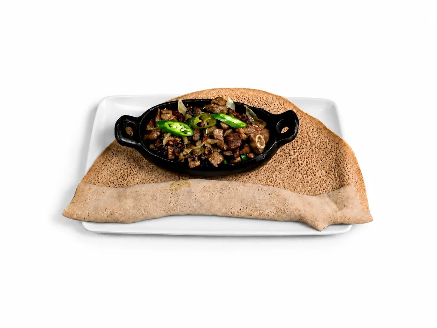 Geba Weta mit gebratenem Fleisch, grüner Chili und Injera